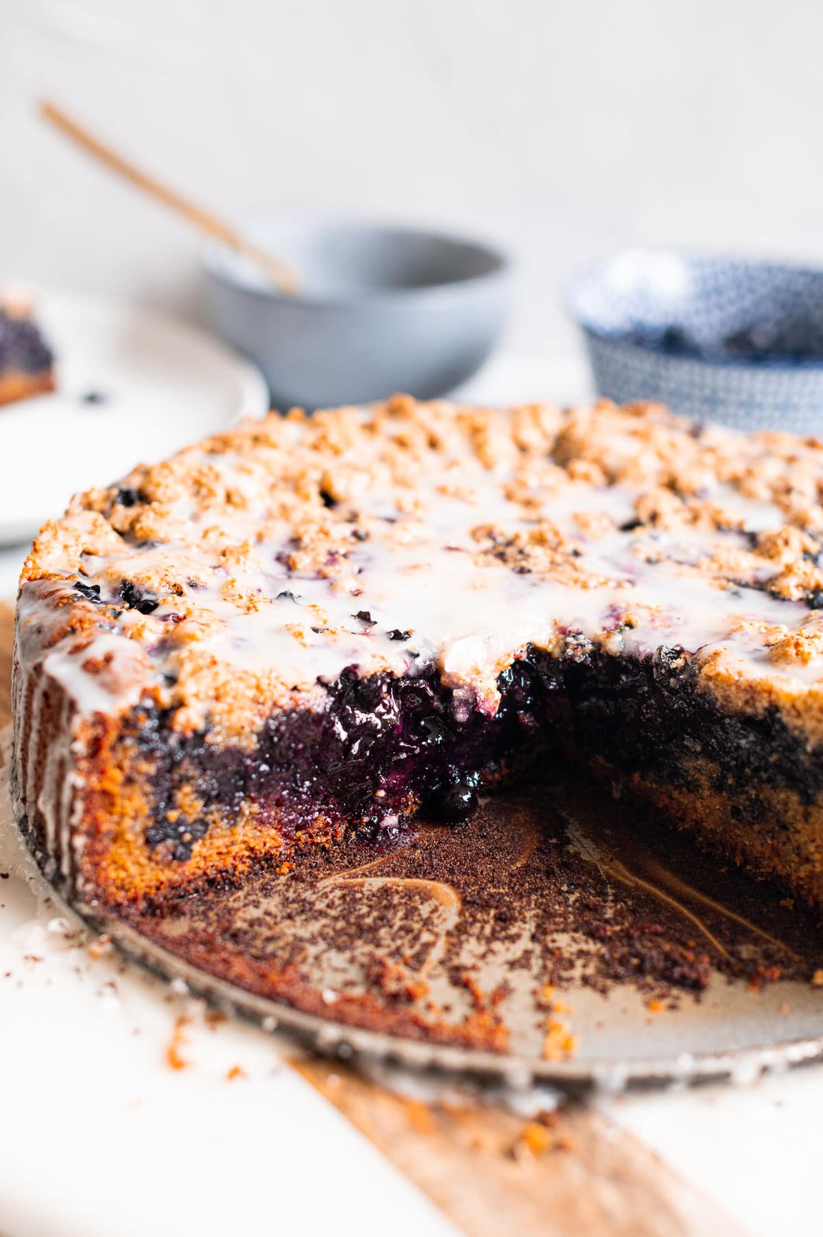 Blueberry coffee cake sliced and showing texture inside.