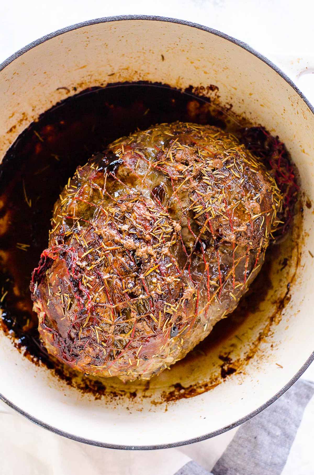 Boneless leg of lamb roast in a dutch oven.