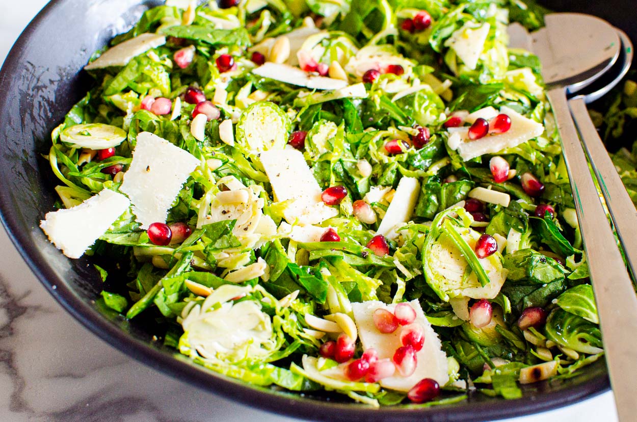 spinach sprouts salad with pomegranate and almonds