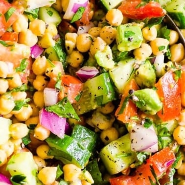 Chickpea avocado salad with cucumbers, tomato and red onion.