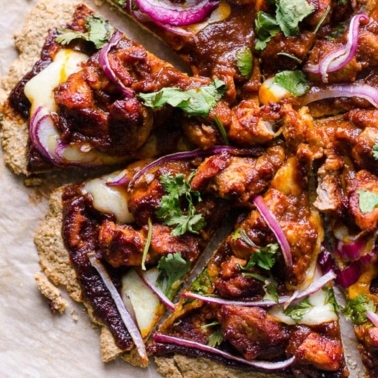 Oatmeal pizza crust with chicken, bbq sauce, red onion and cheese.