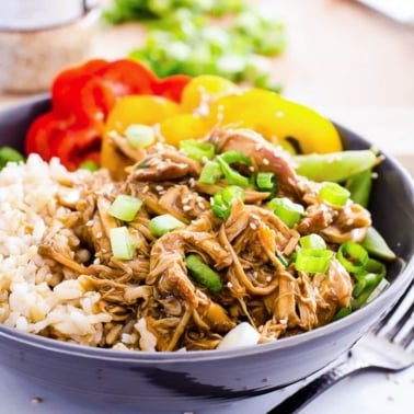 Instant Pot teriyaki chicken bowl with rice and fresh bell peppers for serving