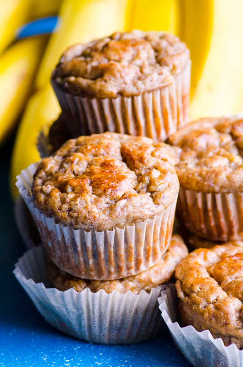A stack of healthy banana muffins in paper liners.