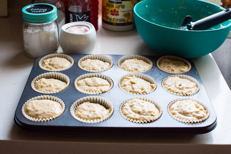 Muffin tin with unbaked healthy banana muffins. 