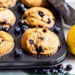 Healthy lemon blueberry muffins in a muffin tin.