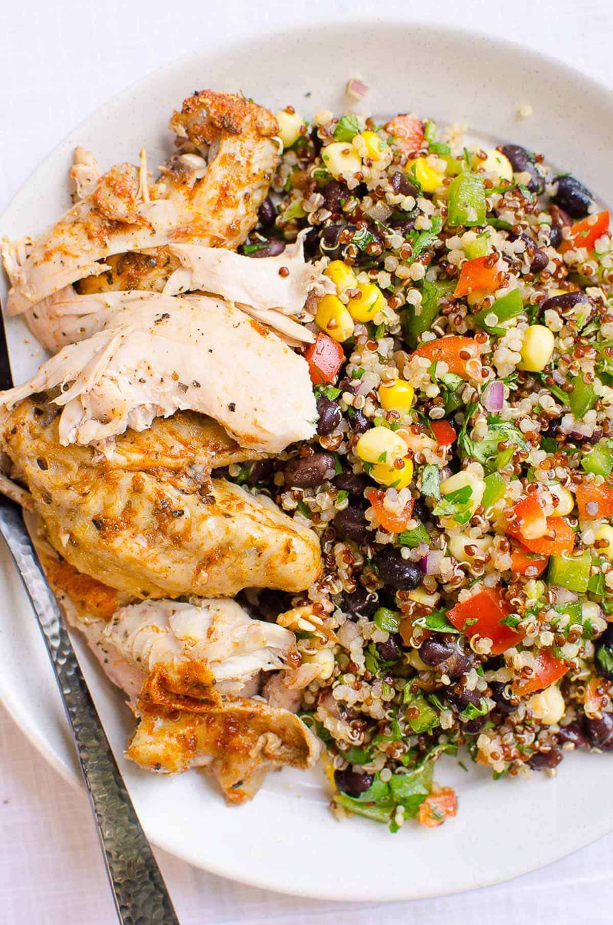 Cooked Instant Pot frozen chicken served with quinoa salad.
