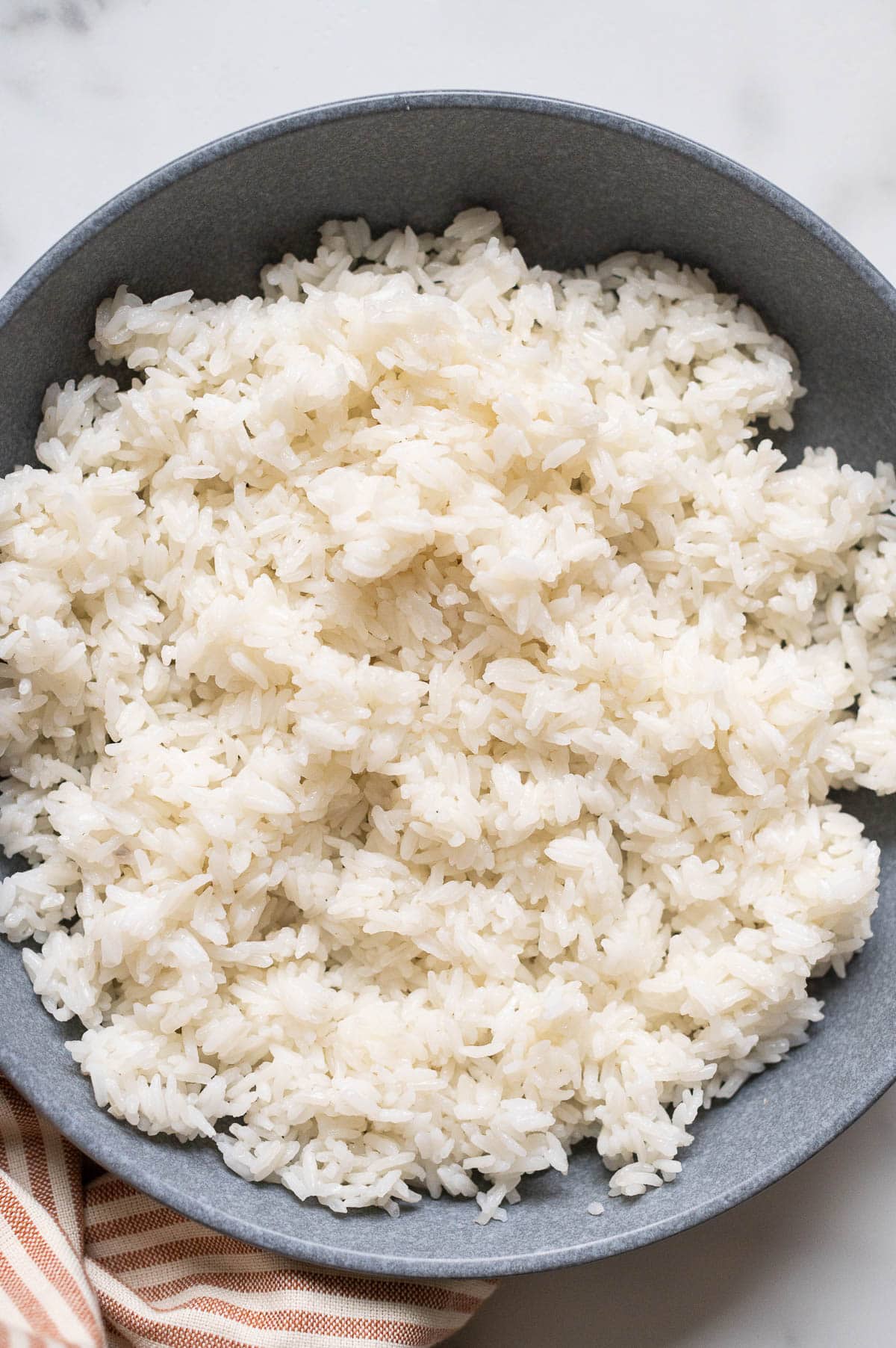 Instant pot long grain white rice in a blue bowl.