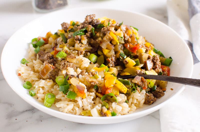 Korean ground beef rice bowl with a fork .