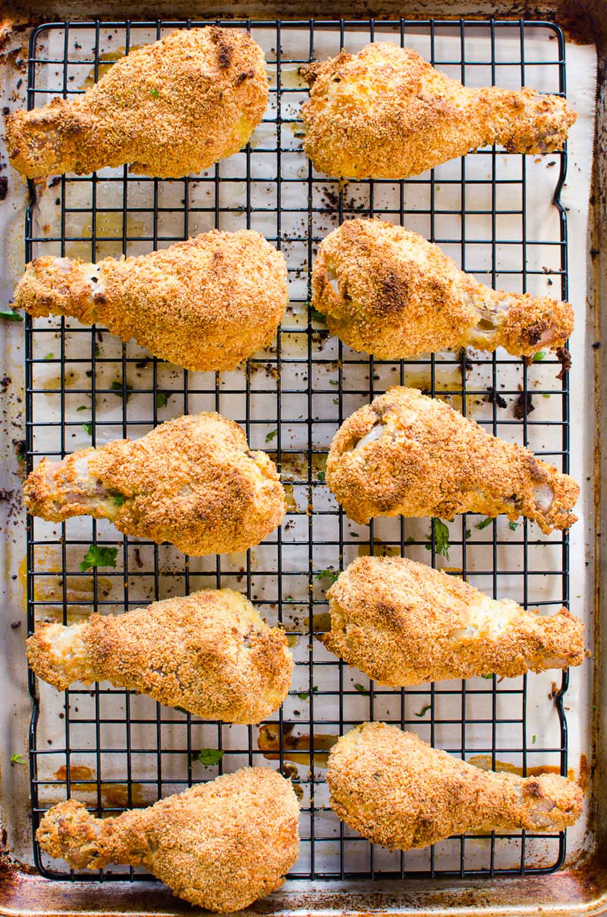 10 healthy fried chicken pieces on a wire rack on top of baking sheet.