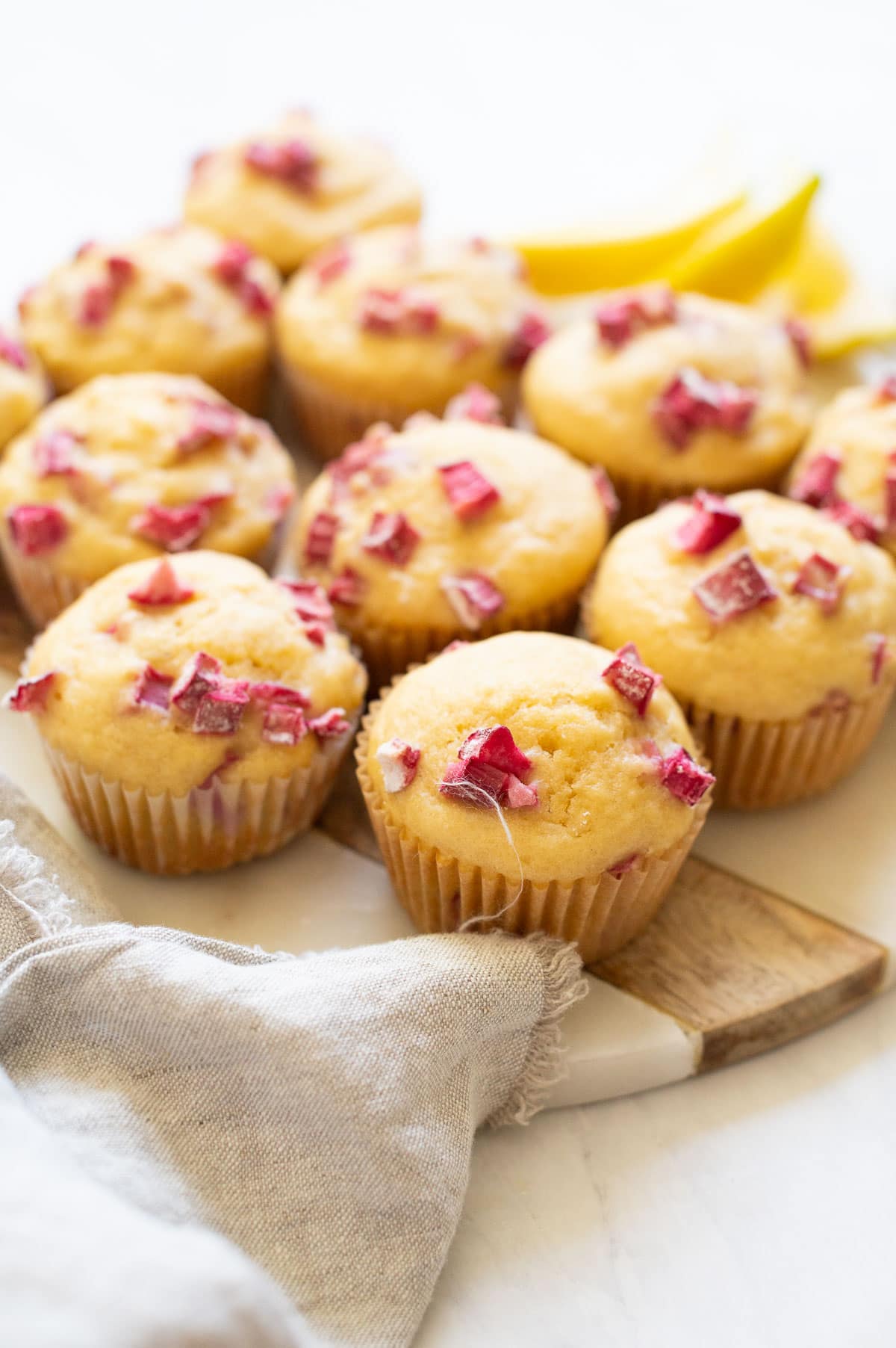 Rhubarb muffins on a serving plate.
