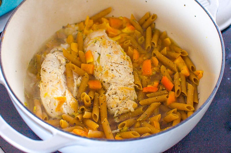 Chicken pasta, and pepper in large pot.